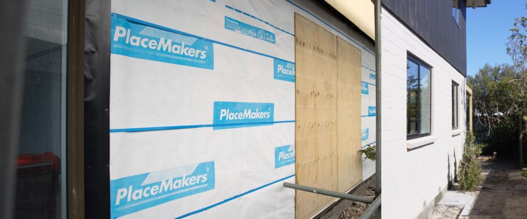 Before and after of a brick wrapped house