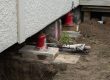 Jack and pack re-levelling work being carried out under a Christchurch home